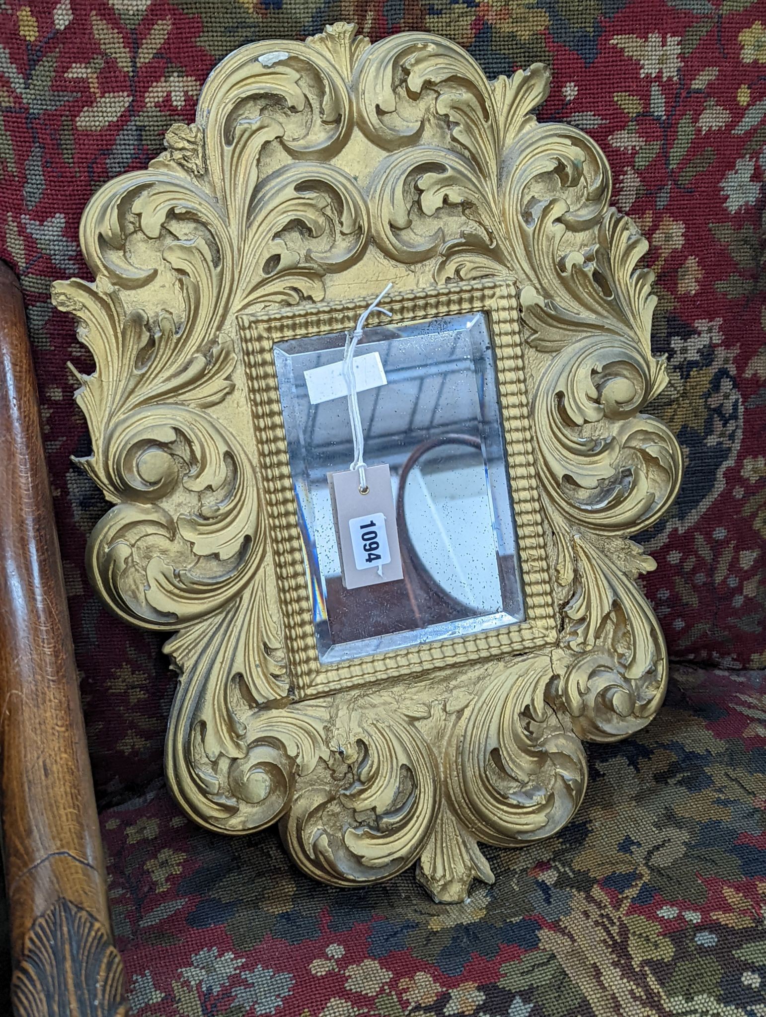 A small Florentine style gilt plaster acanthus scroll wall mirror, width 38cm, height 53cm